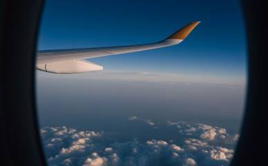 view from airplane window with cloudscape