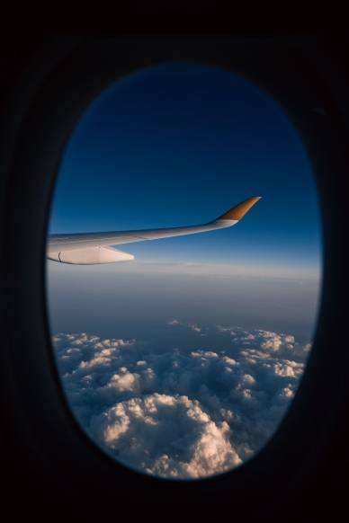 view from airplane window with cloudscape